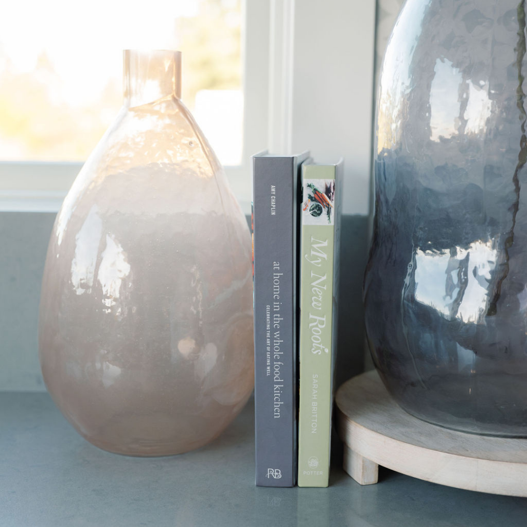 Blush Hammered Vase next to Cook books
