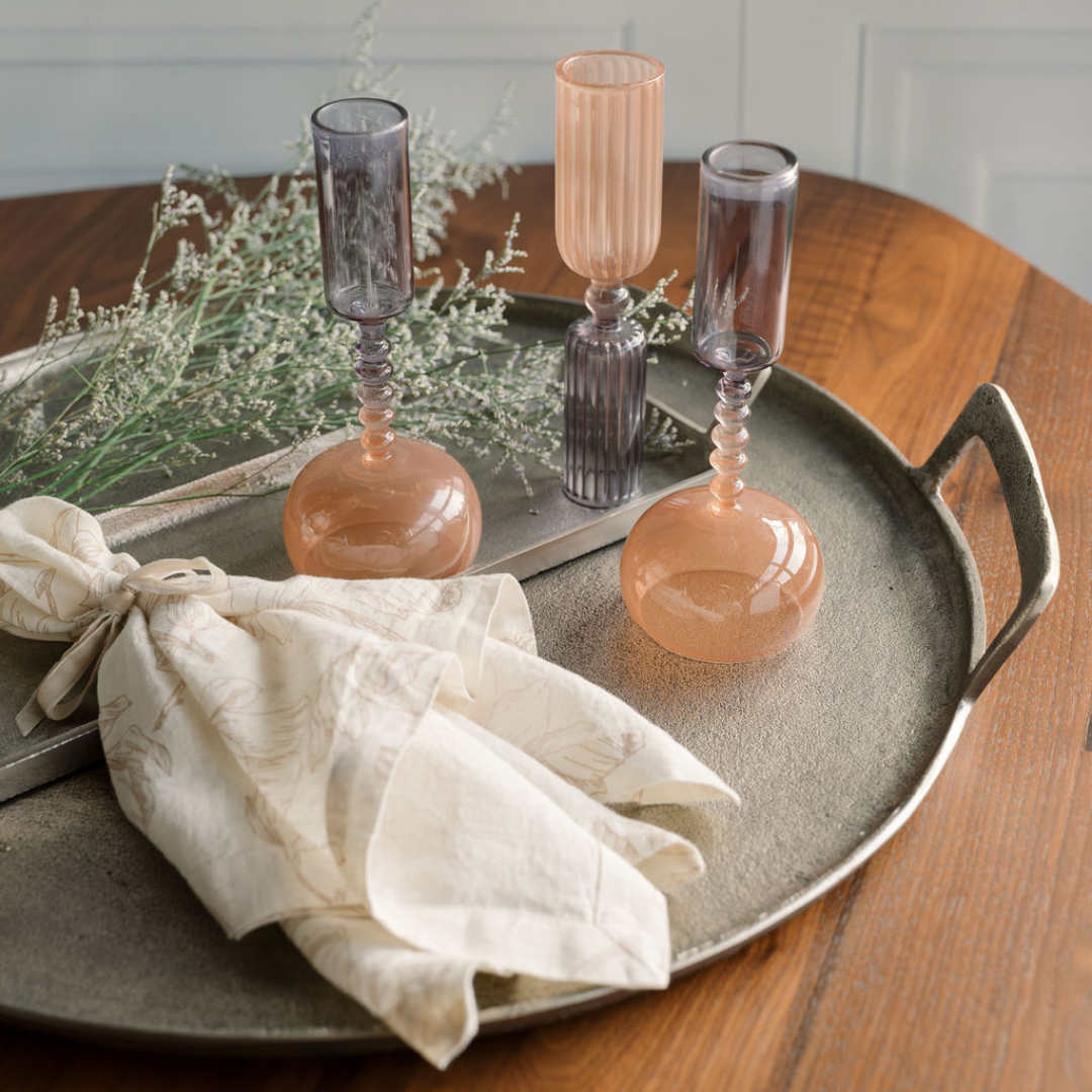 Pink floral linens on table and aluminum tray