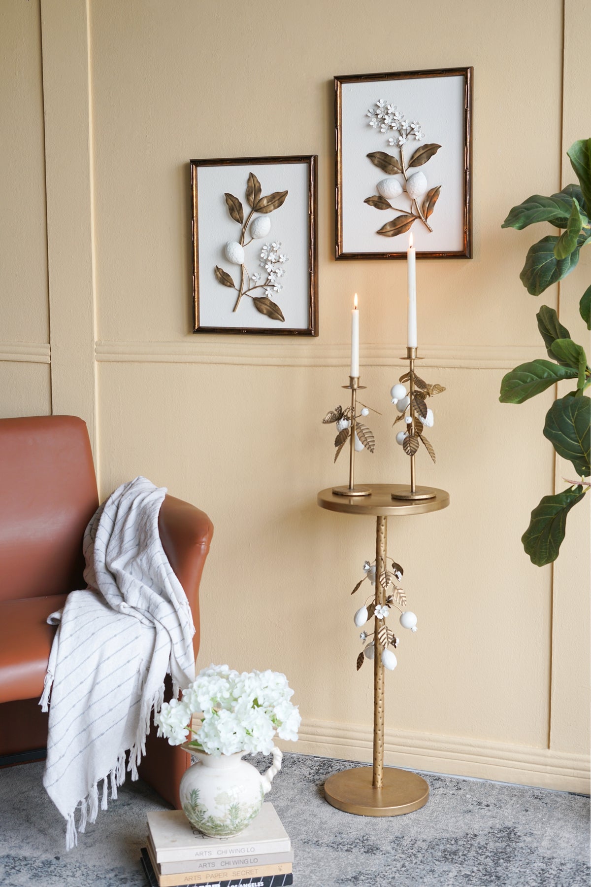 Round Iron Side Table with Gold and White Floral Accents and Cement Base