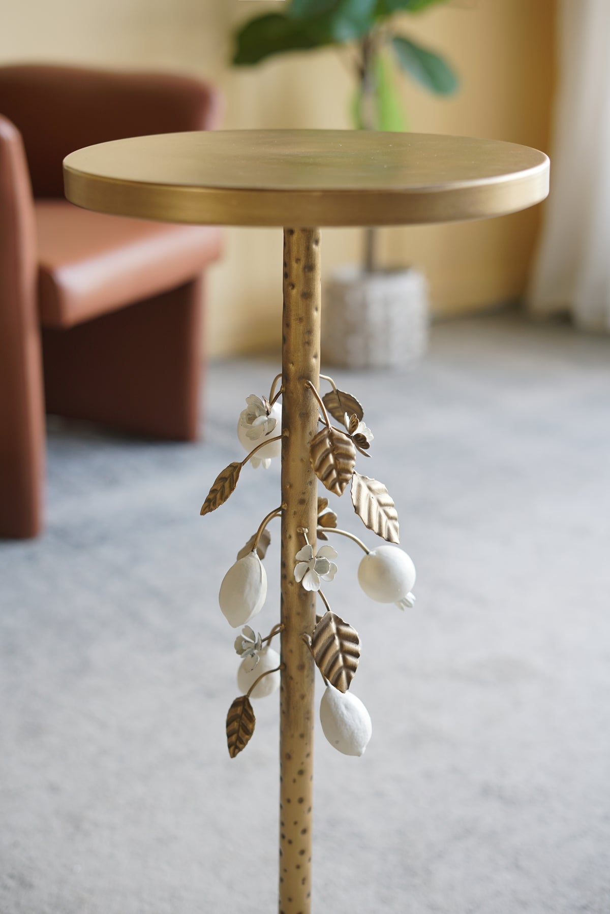 Round Iron Side Table with Gold and White Floral Accents and Cement Base