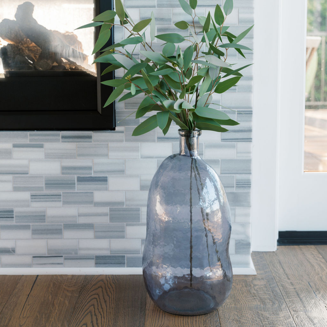 Hammered Blue Vase in Front of Fireplace