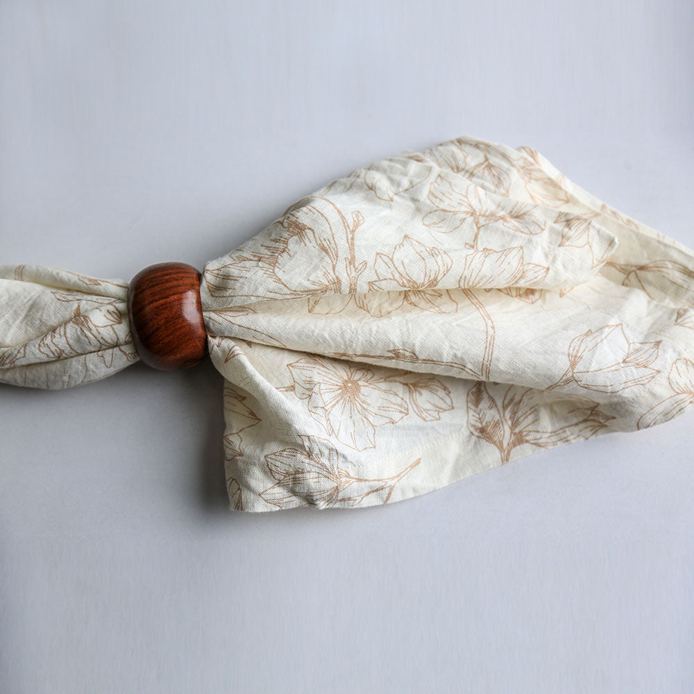 Blush Pink floral linen with napkin ring on white background