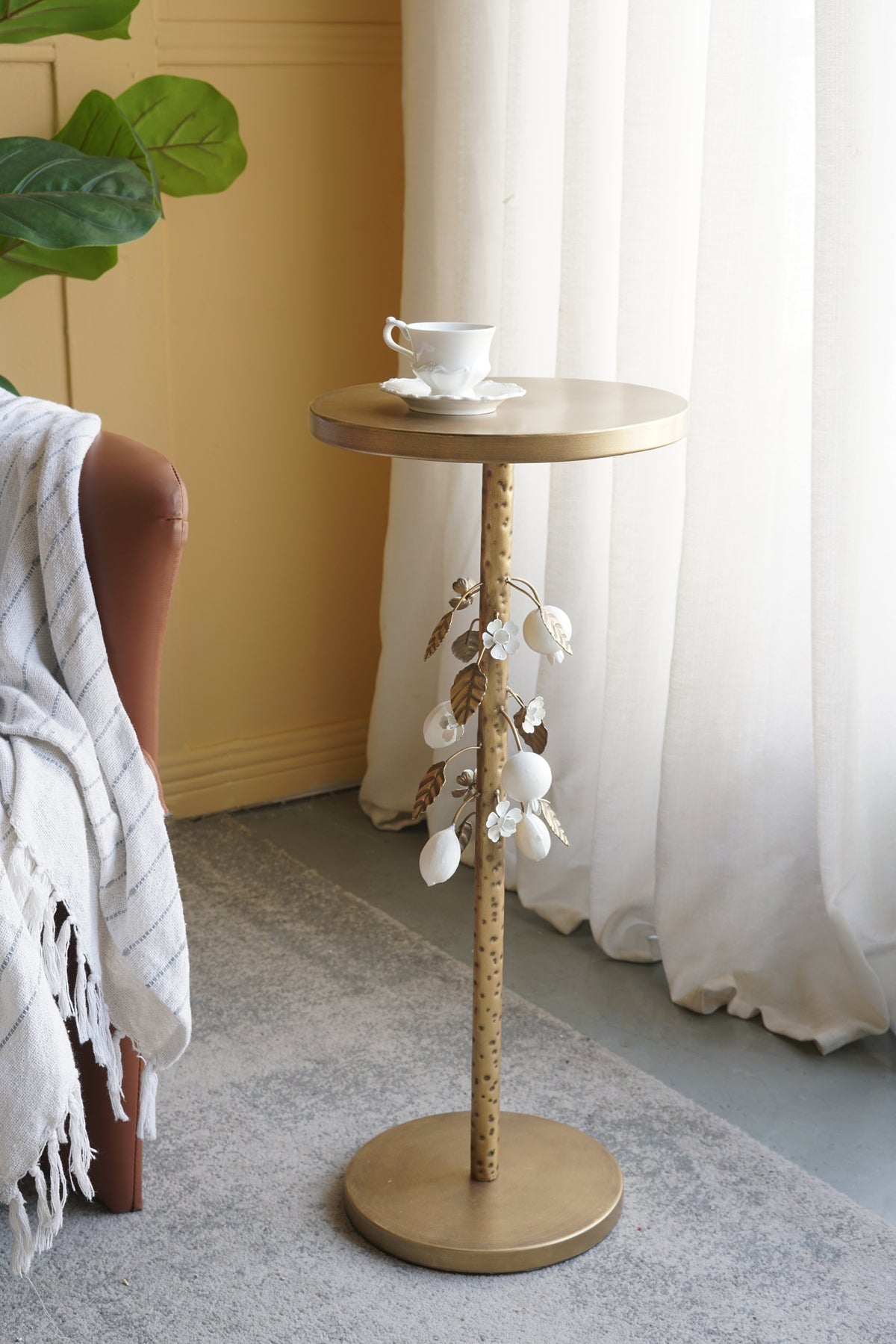 Round Iron Side Table with Gold and White Floral Accents and Cement Base