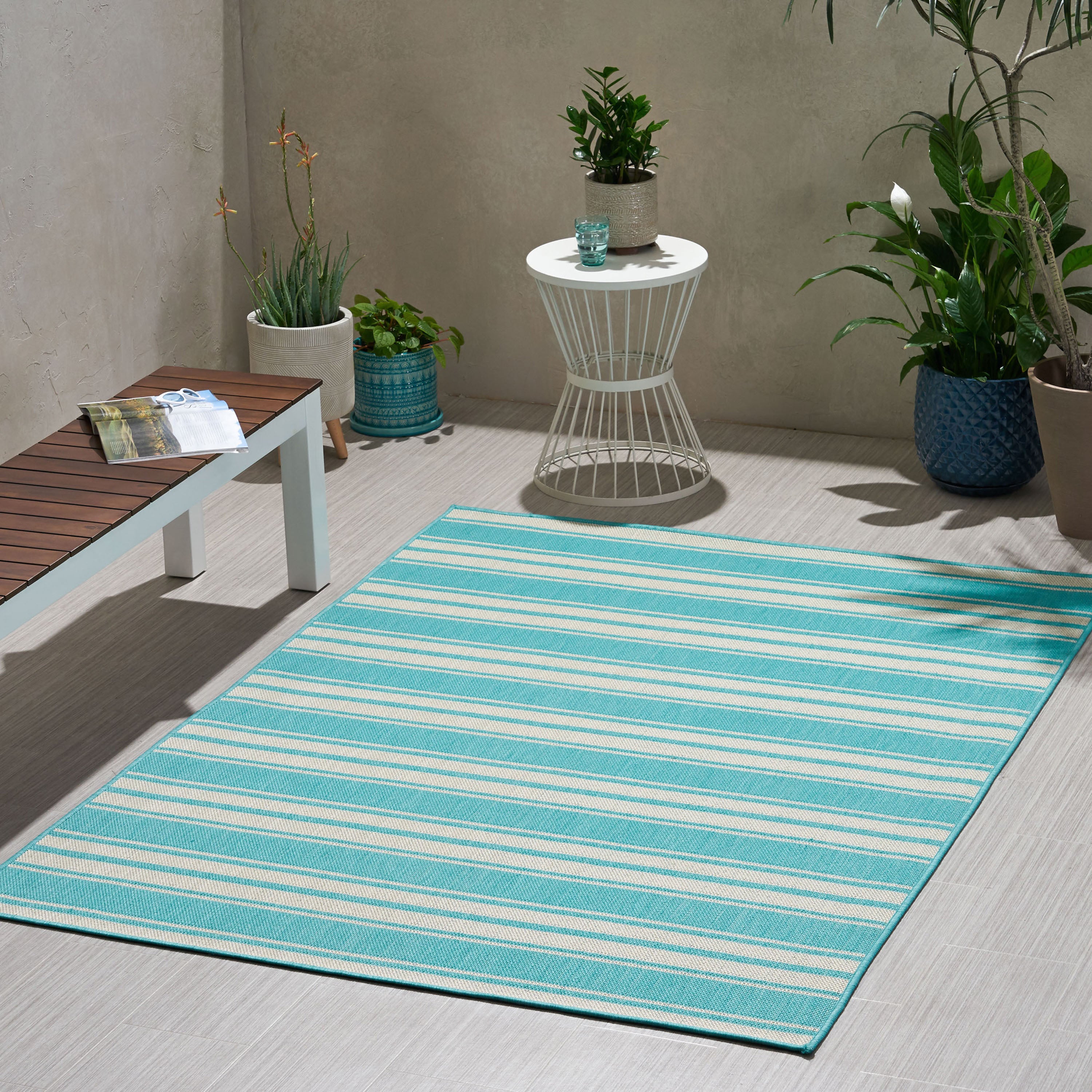 Calamity Teal Striped 63" x 84" Polypropylene Outdoor Area Rug