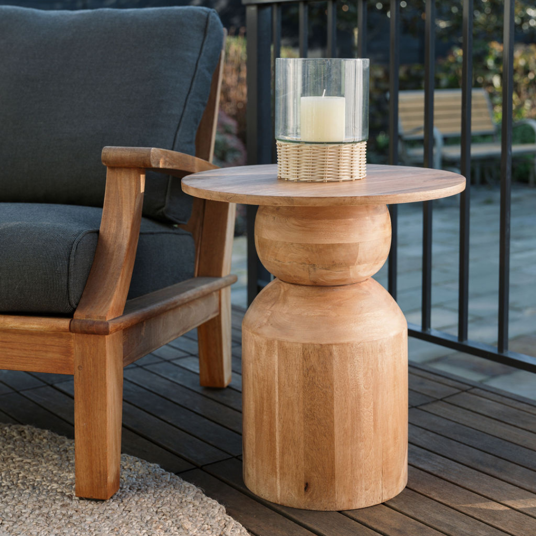 Lare Rattan Candleholder outside on CGH Rug